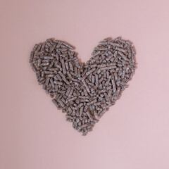 Pellet heart on a light pink background.