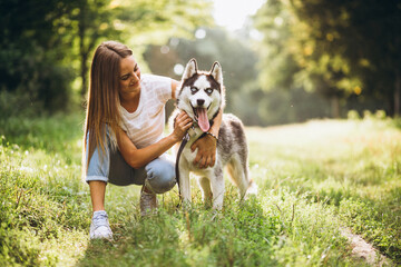 Girl with her dog in park © Petro