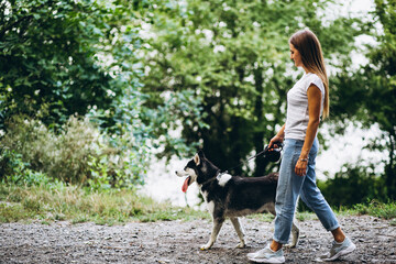 Girl with her dog in park