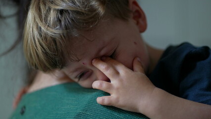 One tearful little boy crying mother consoling child