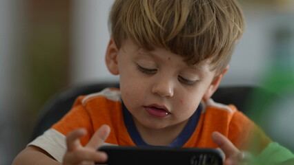 One kid using cellphone device child holding phone