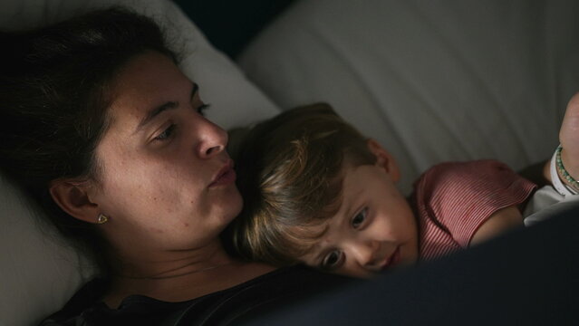 Mother Telling Bedtime Story To Toddler Mom Holding Book Night Routine