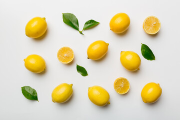 Many fresh ripe lemons as colored background, top view. Elegant background of lemon and lemon slices Top view flat lay