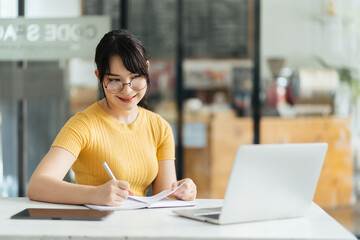 Skilled female software developer working on freelance use code libraries to simplify the...