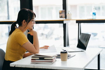 Skilled female software developer working on freelance use code libraries to simplify the...