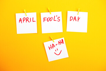 stickers with smiley and inscription april fools day on yellow background.