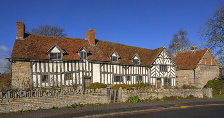 England UK. Traditional houses and cottages in an English Village. Suitable for articles on housing market, finance, mortgage, cost of living etc. Generic property image.