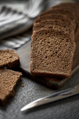 Sliced rye bread on a wooden board
