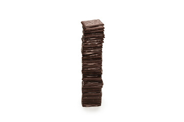 Dark chocolate candies isolated on white background.