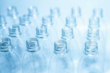 Bottling plant - Plastic bottles. Abstract background of plastic bottles. Selective focus