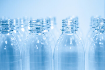 Bottling plant - Plastic bottles. Abstract background of plastic bottles. Selective focus