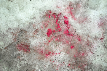 Textured surface of dirty snow with soil and paint on the ground