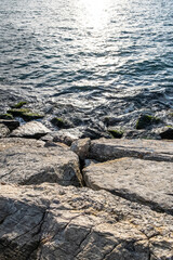 Waves washing rocks in the sea.