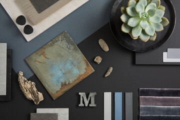 Creative flat lay composition with textile and paint samples, panels and tiles. Stylish interior designer moodboard. Black, blue, beige and dark grey color palette. Copy space. Template. .