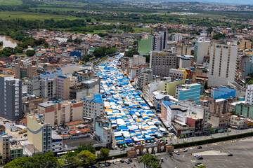 street seen from above with many stalls for commerce