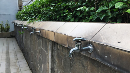 a water faucet in a mosque courtyard