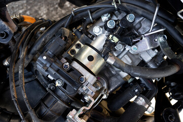 Fototapeta premium closeup detail of motorcycle engine in service center with soft-focus and over light in the background