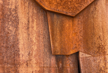 fragment of an old rusty volumetric structure or wall, rust effect, texture or background