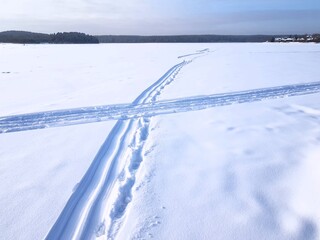 Ski track laid in a snowy field