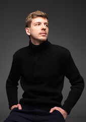 Fototapeta premium Young blond european man with short beard and mustache isolated on dark grey in total black