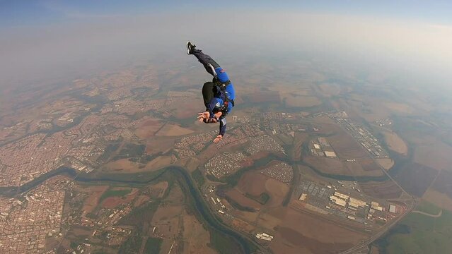Parachutist performing roll over maneuver.
