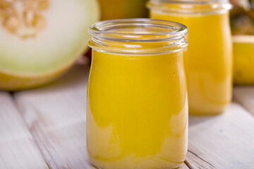 pineapple and mango melon shake on white wood