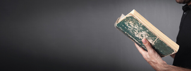 Caucasian man holding bible. Religion