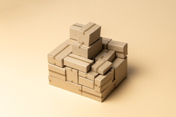 Heap cardboard boxes on a brown background