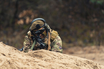 Ace shooter aiming to kill targets on battleground. High quality photo