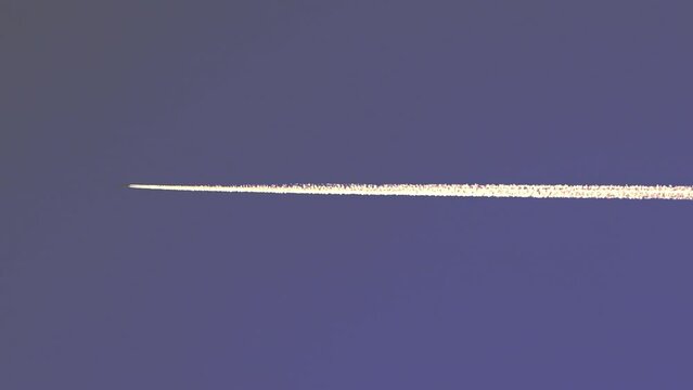 airplane contrail against blue sky
