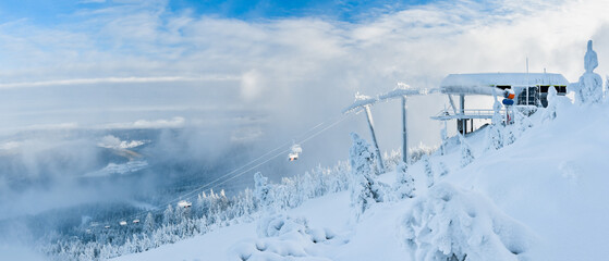 Winter landscape in the Polish mountains of the Sudetes, a ski lift on the Czarna Gora mountain, a...