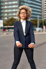 Portrait of business african american girl in fighting pose. Hard business concept