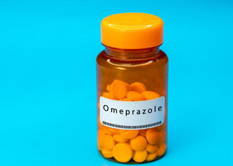 Medical vial with Omeprazole pills. Medical pills in orange Plastic Prescription