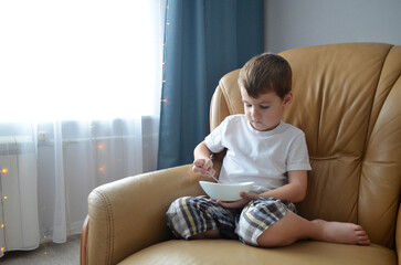 child sitting on a sofa