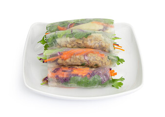 close-up Vegetarian vietnamese spring rolls, carrot, cucumber, red cabbage and rice noodle. Vegan food. Tasty meal.