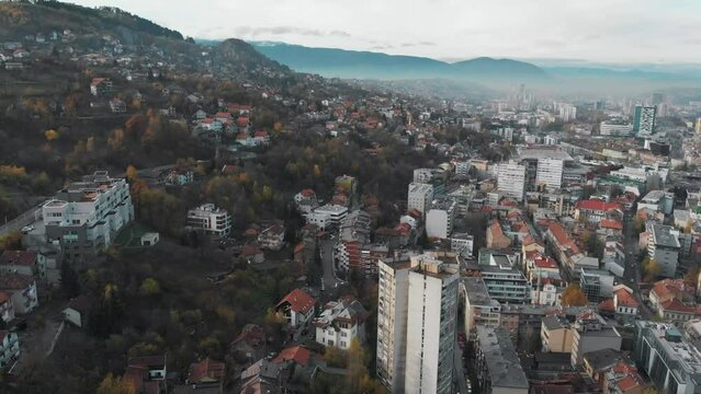 Early morning drone shot in Bosnia's capital Sarajevo. Shot during autumn, the colors of the trees make this city so beautifull.