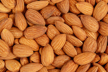 Pattern of peeled organic almonds. Healthy eating, top view