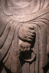 Close-up of hand movements of stone-carved Bodhisattva statues in ancient Chinese Buddhist temples