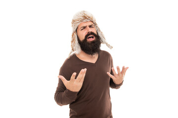 suffering bearded man portrait. mature man with beard in earflap hat. beard hair care.