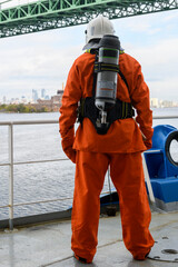 Fireman. Fire fighting equipment. Fire drill. Seaman with fire-fighter’s outfits and Breathing...