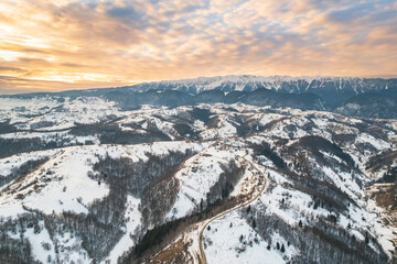Sunset winter landscape from Transylvania Romania, Pestera Village in search for wilderness,...