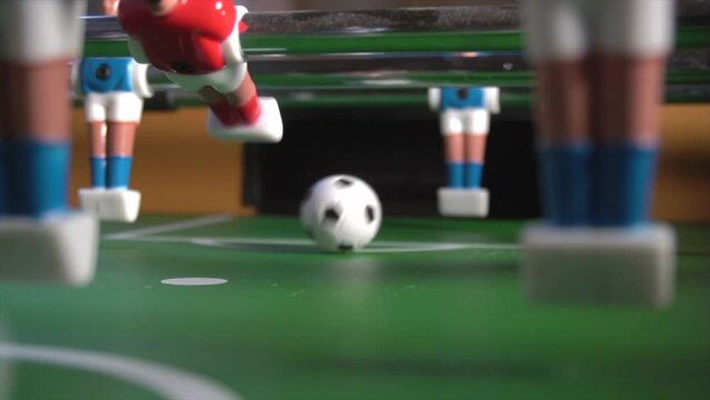 4K Playing Table Soccer Game Macro Closeup in super slow motion. Target Concept
