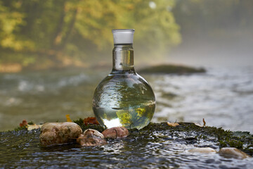 Flask with clear river water.