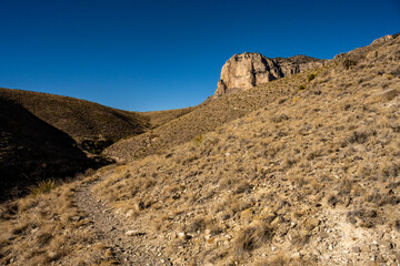 The El Capitan Trail Rounds A Hill Side On The Way to The Namesake Outcropping Ahead