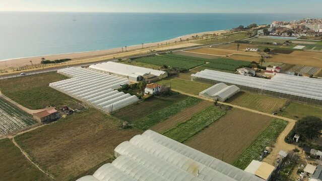 Pineda de Mar in Barcelona's Maresme beach drone aerial view in winter without people crop fields Spain