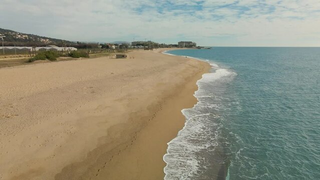 beach Pineda de Mar in Barcelona's Maresme drone aerial view in winter without people