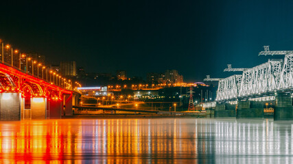 View of the river between two illuminated bridges. night city background