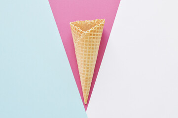 waffle cone on geometric colorful background