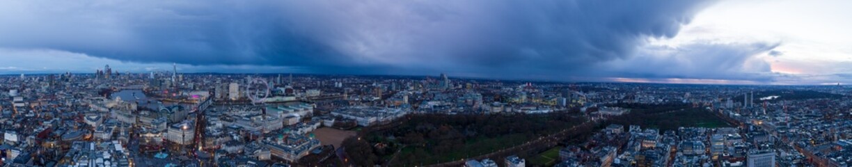 Fototapeta na wymiar Aerial Panoramic view of London at dusk with storm clouds.