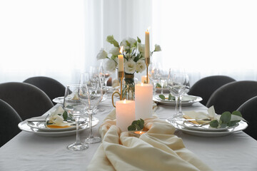 Festive table setting with beautiful floral decor in restaurant